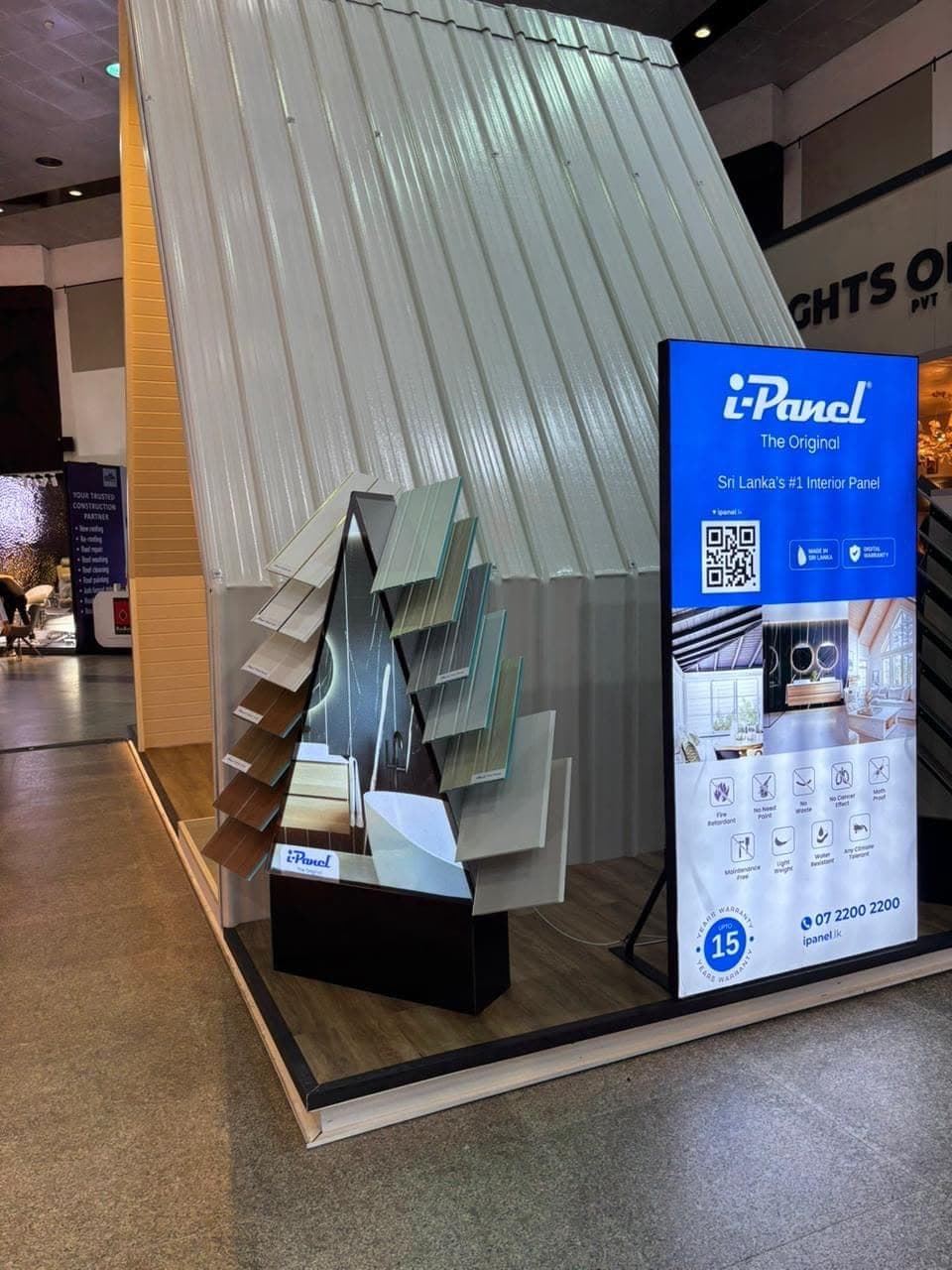 i-Panel interior-panel display stand with sample shelving and a digital screen