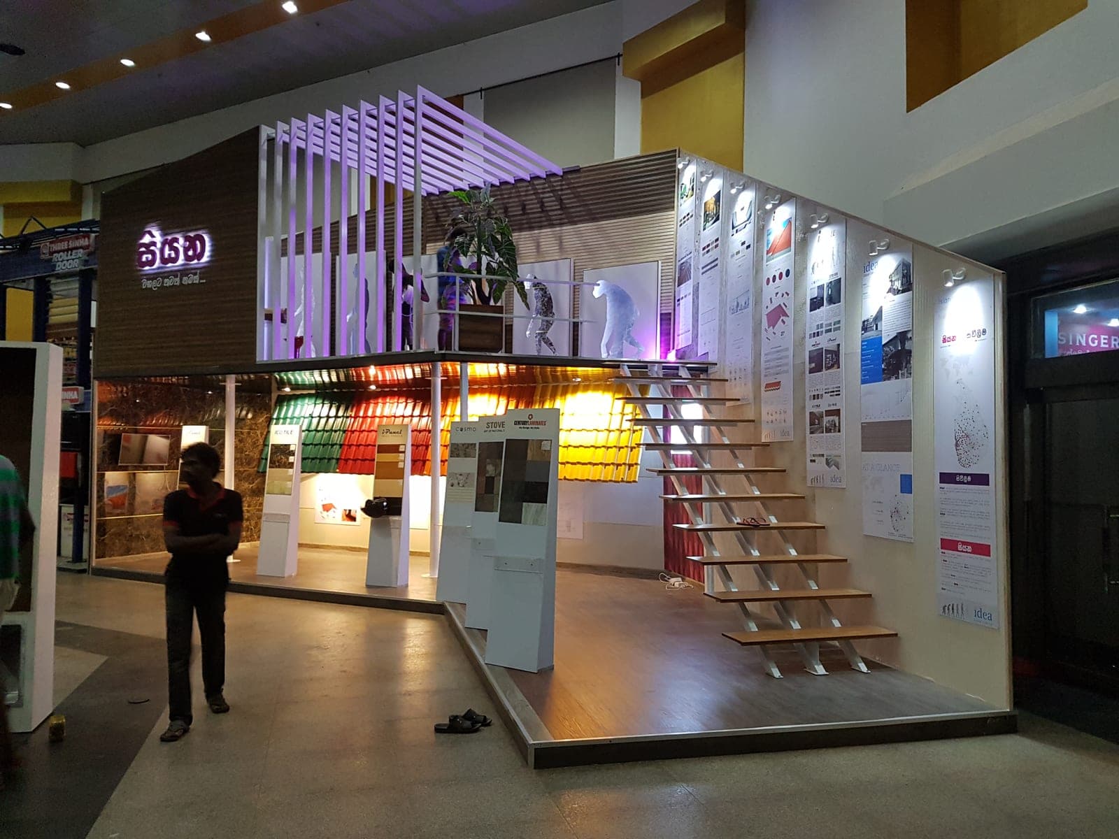 Colourful backlit exhibition shelving wall with product niches