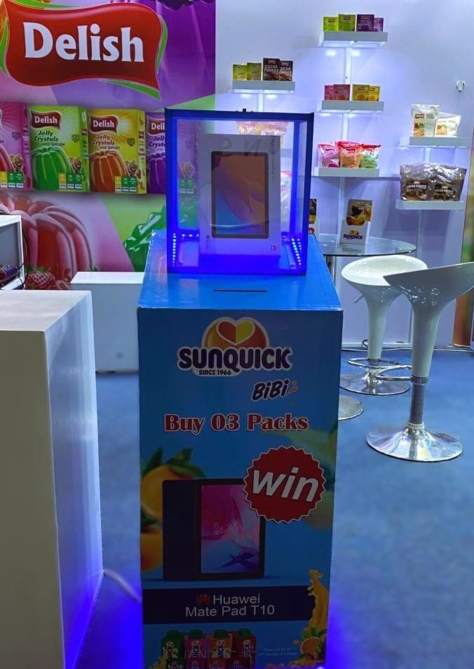 Sunquick BiBi promotional plinth with a 'Win' panel beside the jelly display