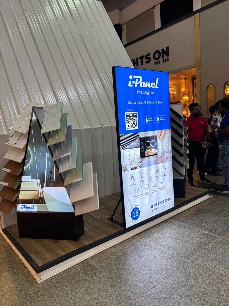 i-Panel display stand with a sample staircase and a digital screen
