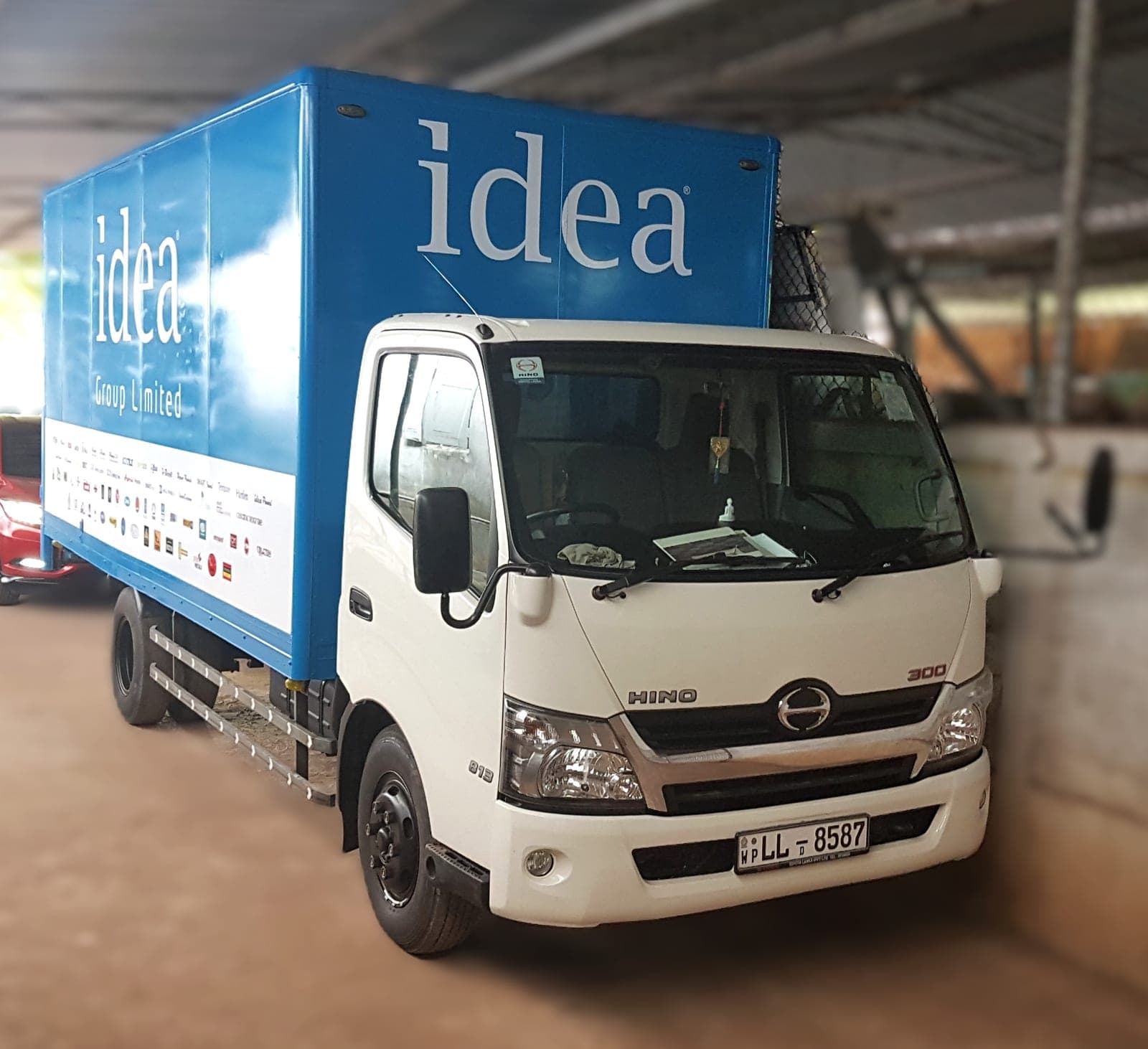 'idea' branded Hino truck container, front-side view