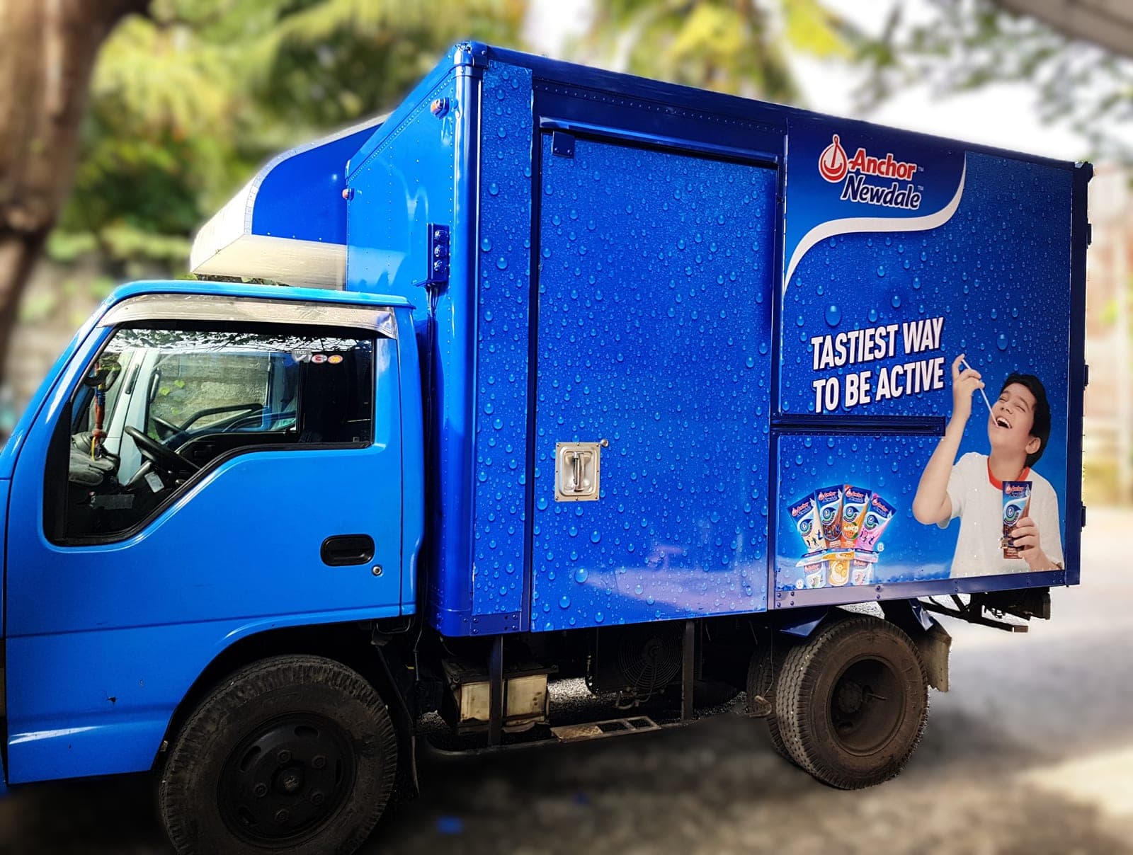 Anchor Newdale branded delivery truck, 'Tastiest way to be active', front-side view